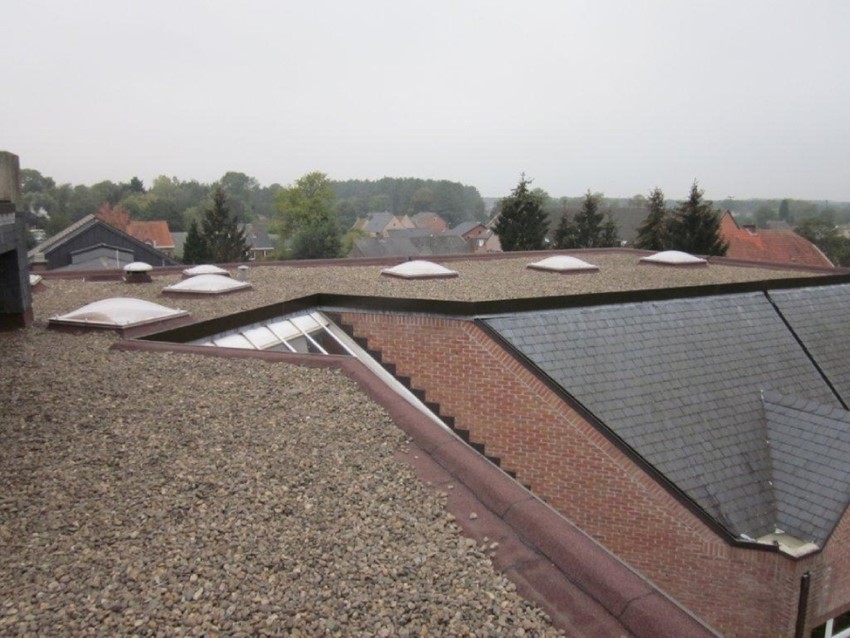 Vernieuwen van de waterdichting op het dak | bibliotheek